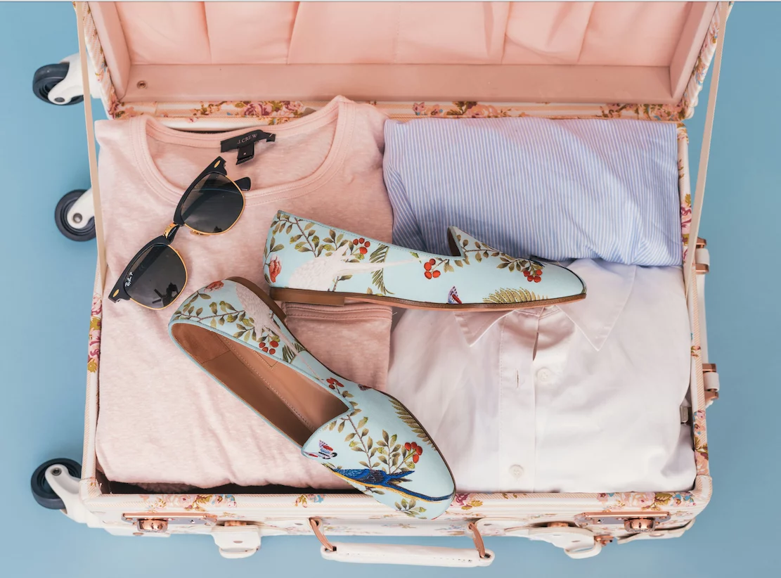 Suitcase packed with clothes